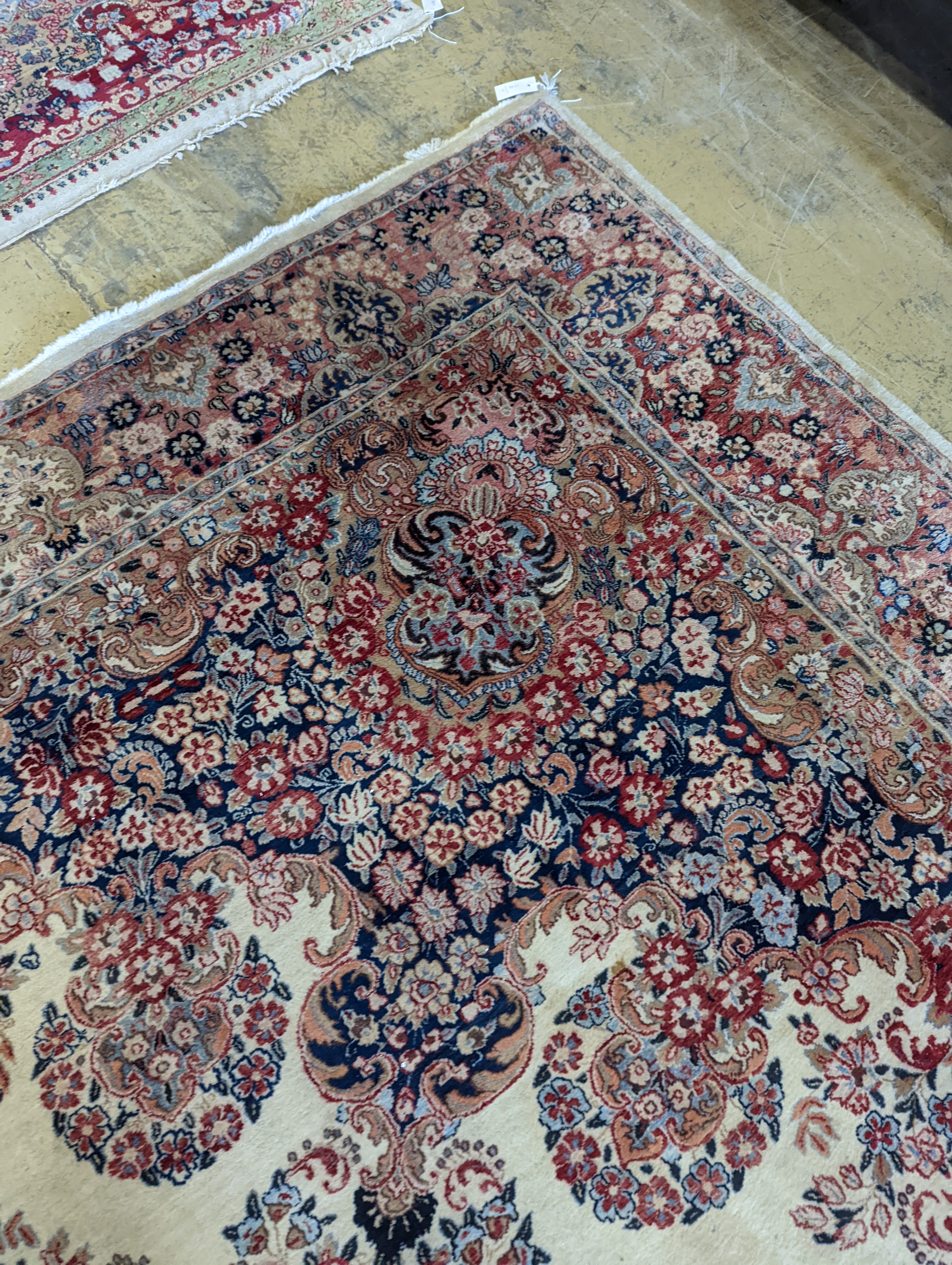 A North West Persian ivory ground carpet, 410 x 310cm